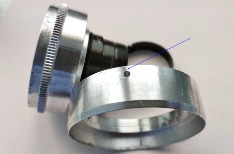 Reference mark next to screw recess
