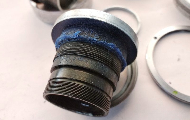 Dirty aperture mechanism covered in hardened grease