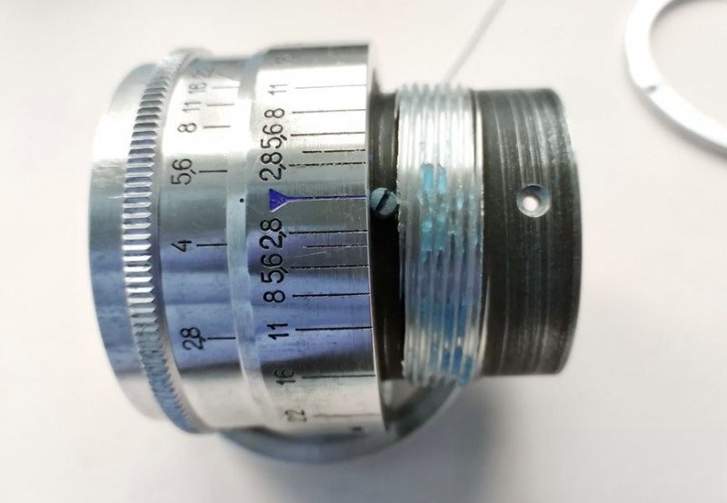 Applying fresh grease to helicoid threads