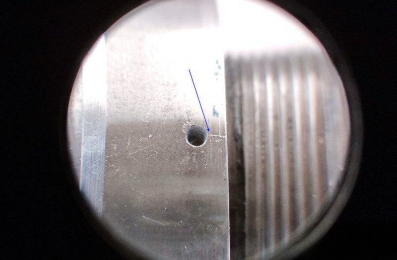 Deep-set screw marked for identification