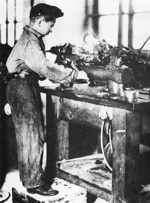 Young communards working in the machine shop of the Dzerzhinsky Commune, 1934