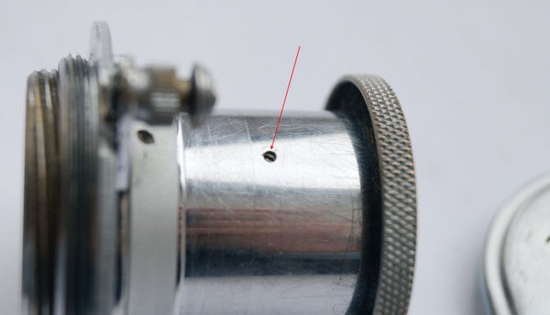 Removing securing screw that prevents optical block rotation