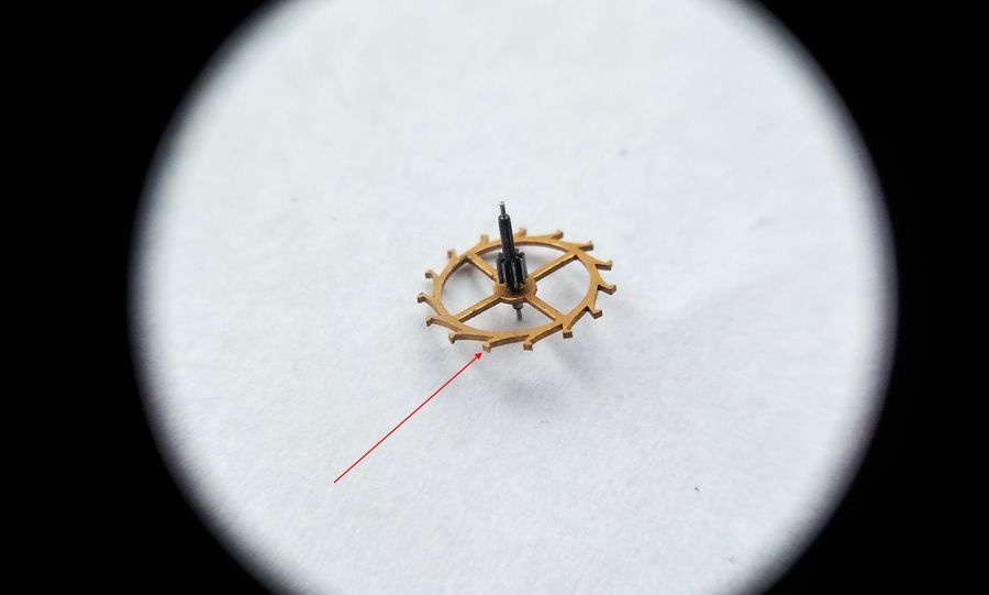 Escape wheel showing specially shaped teeth