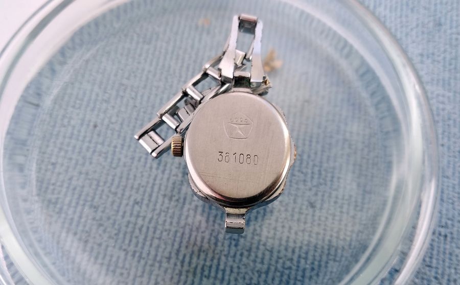 Case back of the Luch watch stamped with the Soviet State Quality Mark and a serial number