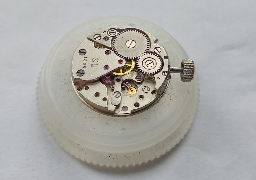 Balance side of the Luch 1809 with the crown wheel and ratchet wheel still on the barrel bridge