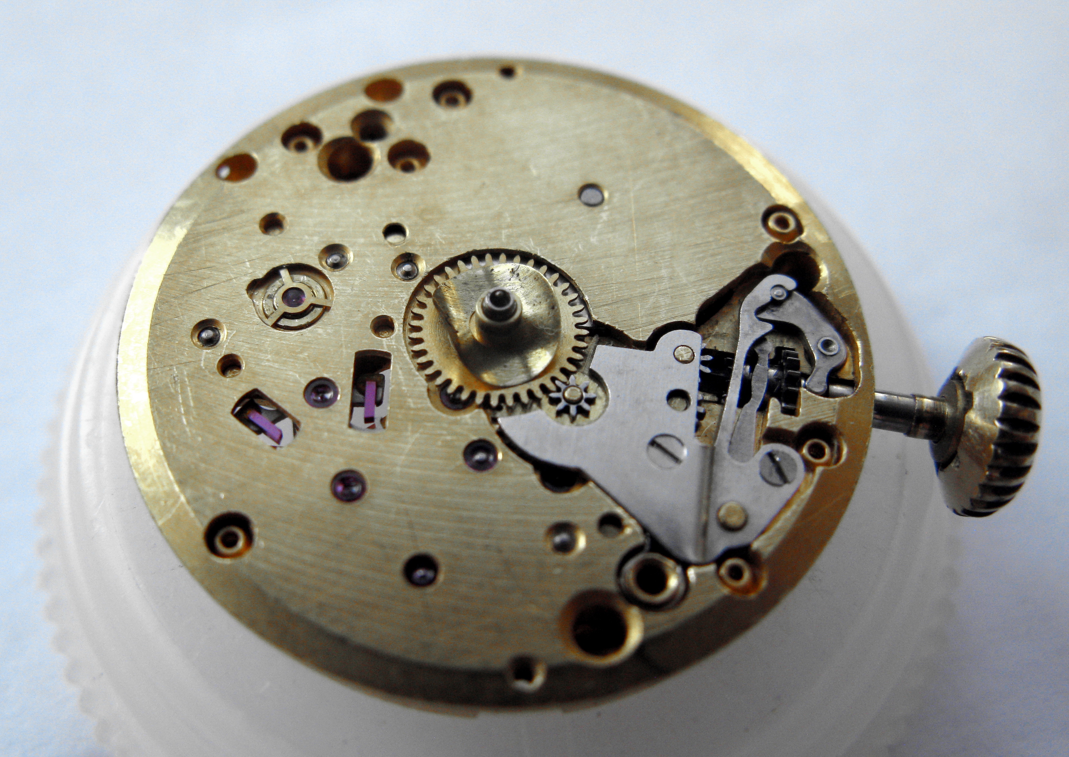 Dial side with the cannon pinion and keyless components fitted, crown and stem in place.