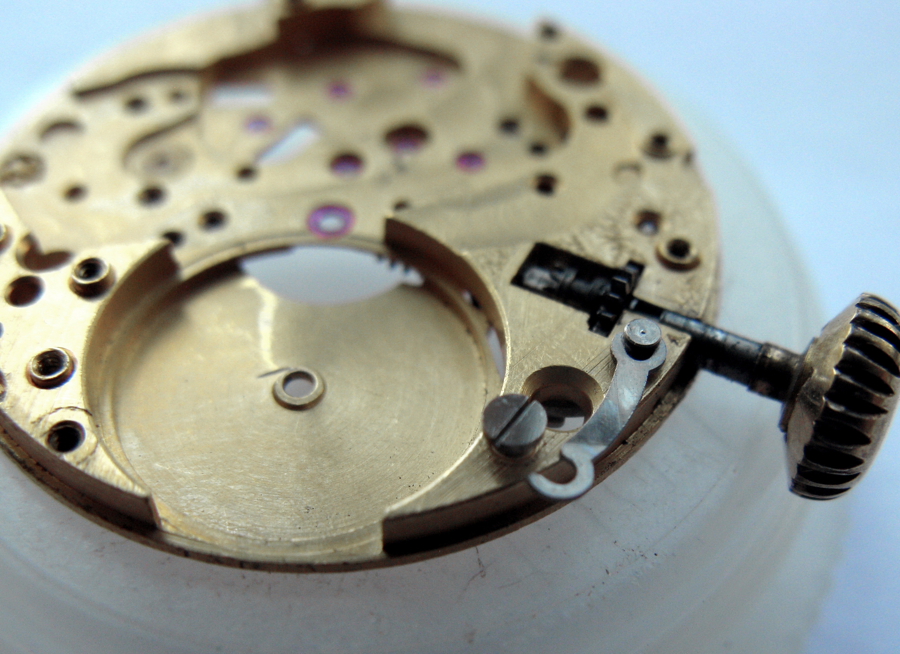The setting-lever spring released after loosening its screw, crown and stem alongside.