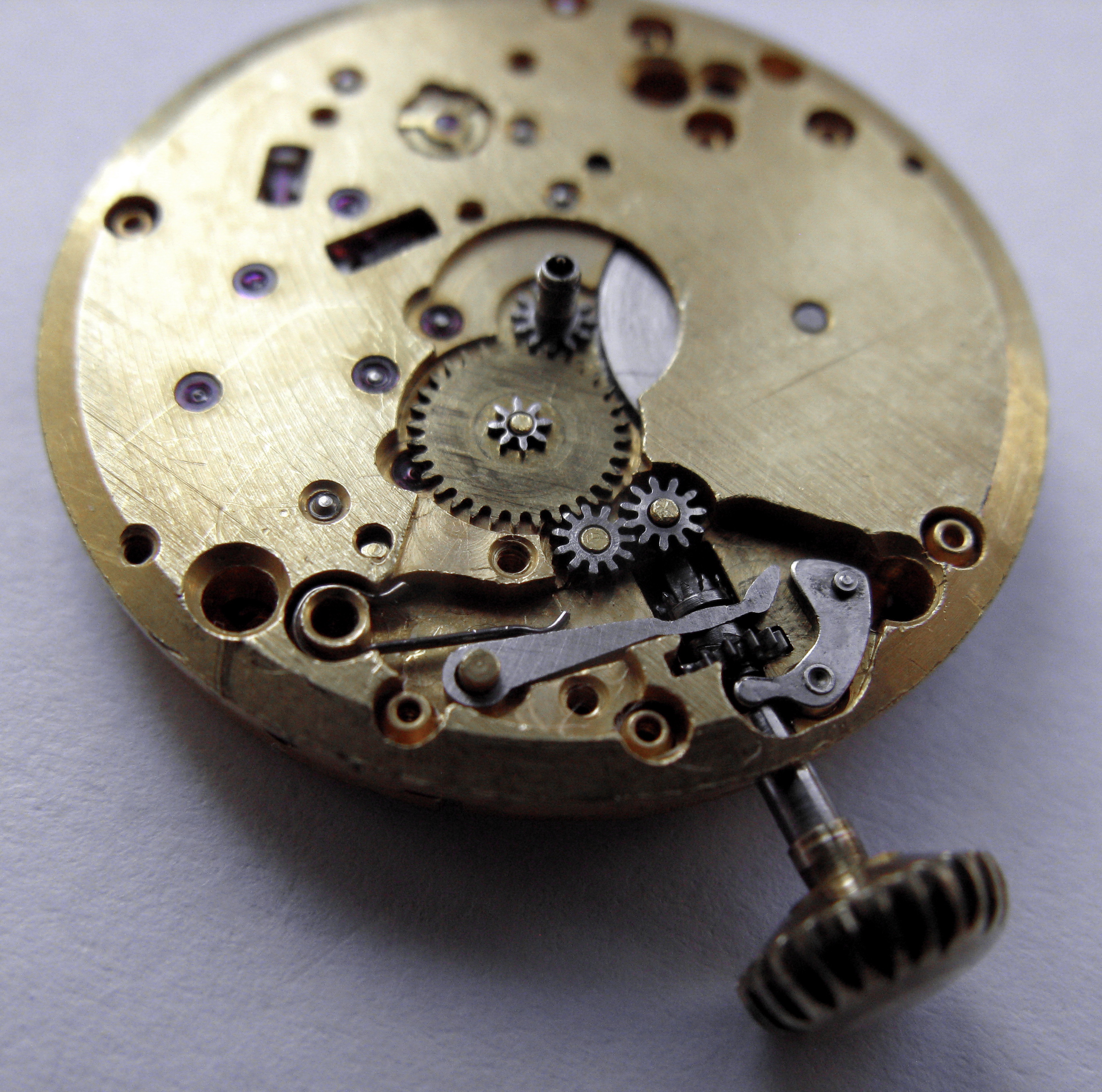 Dial-side reassembly of the motion work and keyless, a large wheel and setting lever around the stem.