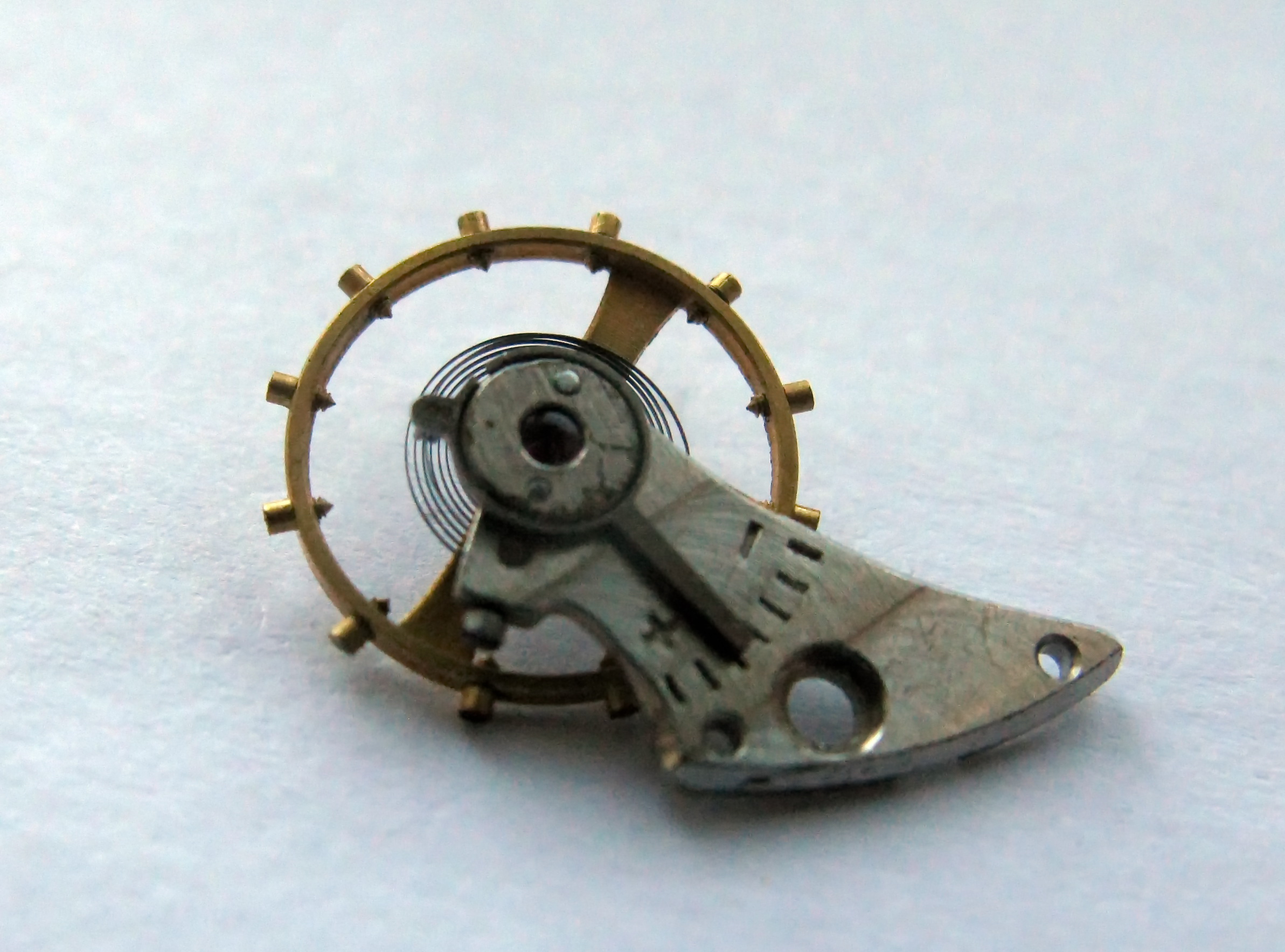 The balance wheel reinstalled into the cock.