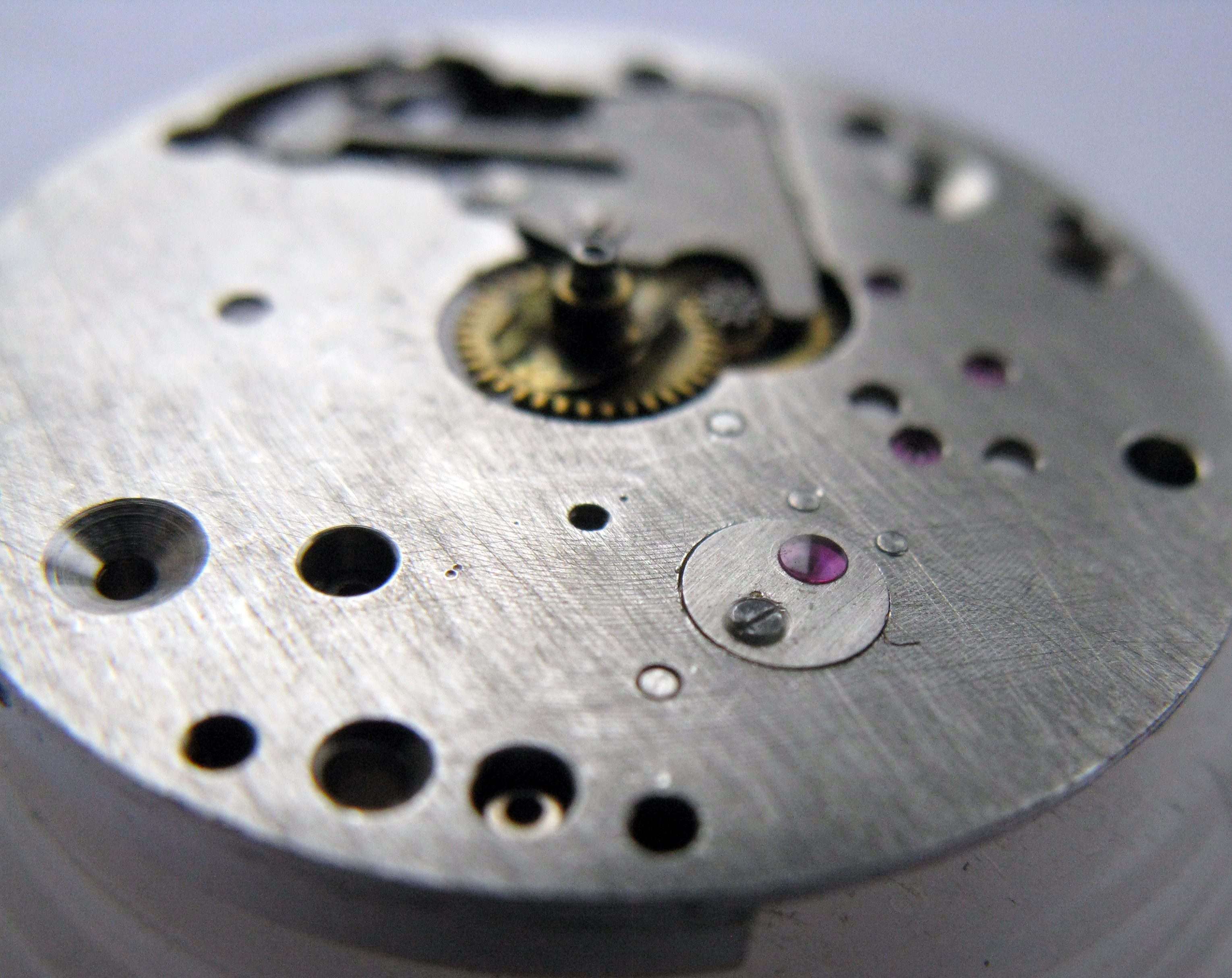 Close-up of the balance cap jewel set into the mainplate.