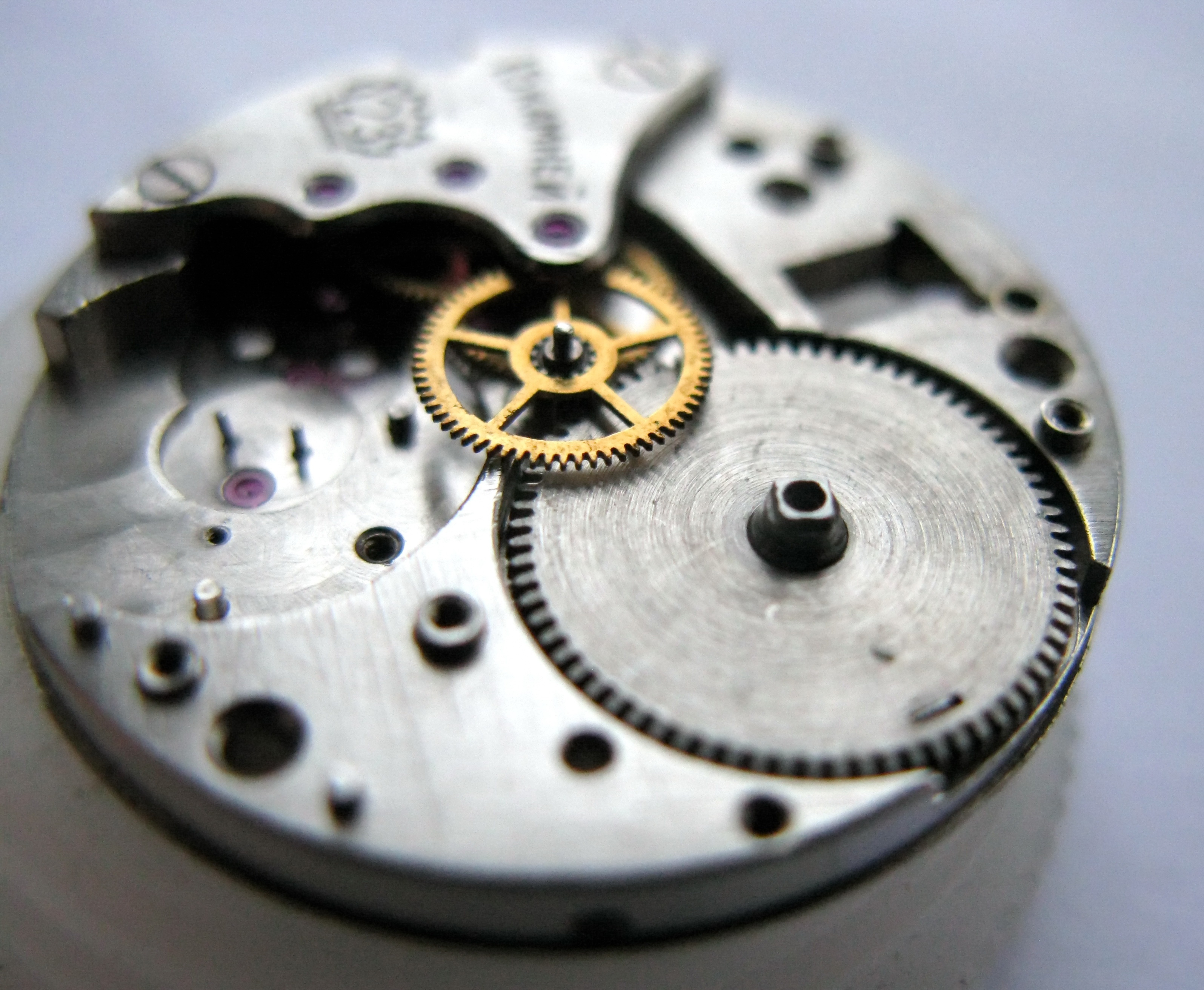 The barrel set into its seat in the movement.
