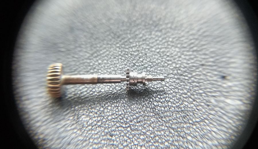 The winding pinion and castle assembled on the stem with their ratchet rings closed together in winding position