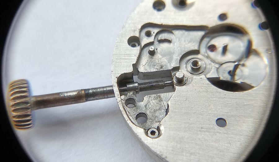 The winding stem drawn outward in the main plate, the hand-setting position