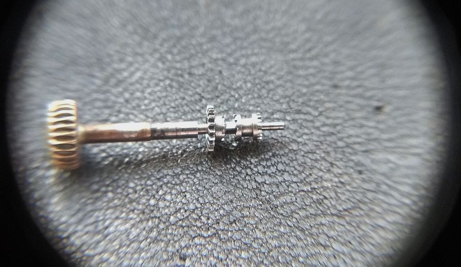 The castle slid clear of the winding pinion so its crown end stands ready to engage the setting wheel