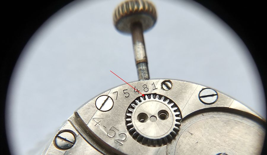 The crown wheel fitted, meshing with the winding pinion to complete the manual winding path