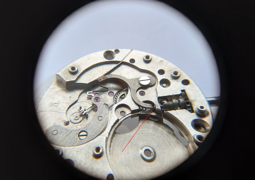 The 2609 stem pulled to setting position: the tail withdraws into its tunnel and the stop lever moves the finger toward the balance