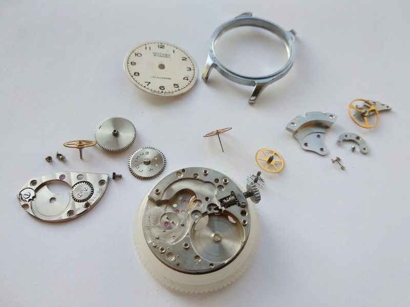 All components of the 2608 movement laid out after complete disassembly