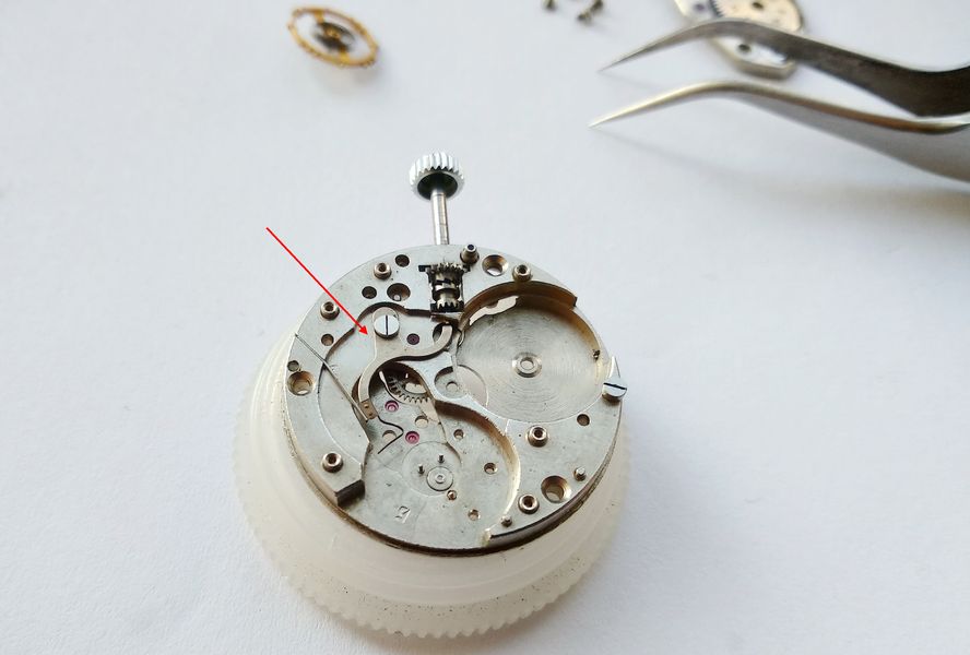 The added stop-seconds parts on the 2609: a stop lever with a spring finger and its flat actuating spring