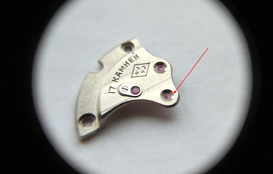 Adjusting the height of the newly set seconds-wheel jewel by eye to control endshake