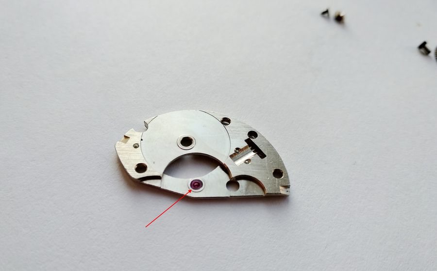 Lubricating the barrel bridge of the 2608 — the center-wheel jewel and the barrel-arbor hole — before fitting