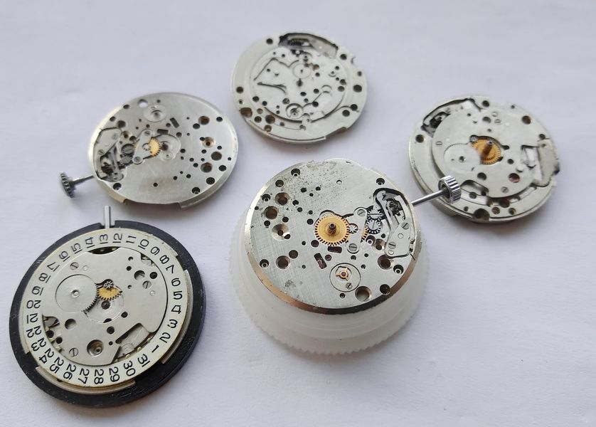 The early Poljot 2609 movement displayed alongside later 2609.Н-based movements