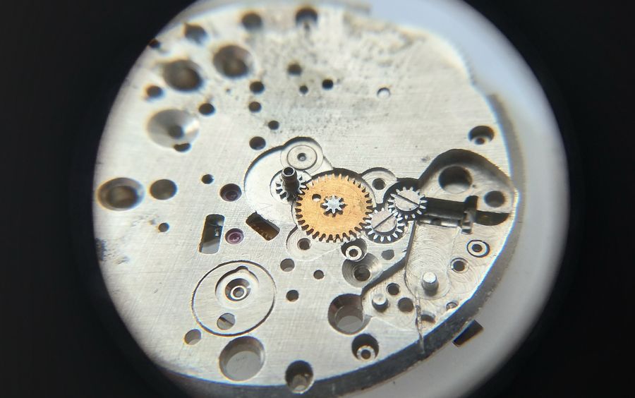 Fitting the jewelled minute wheel after the cannon pinion is in place