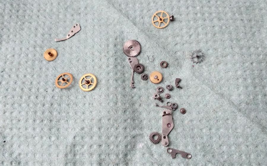 The cleaned components gathered, ready to be reinstalled on the main plate