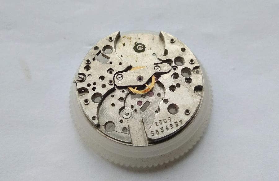 The centre-wheel bridge removed after unscrewing its two screws