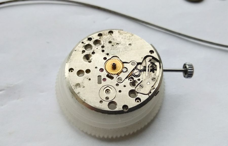 The dial side of the movement at the start of motion-works disassembly