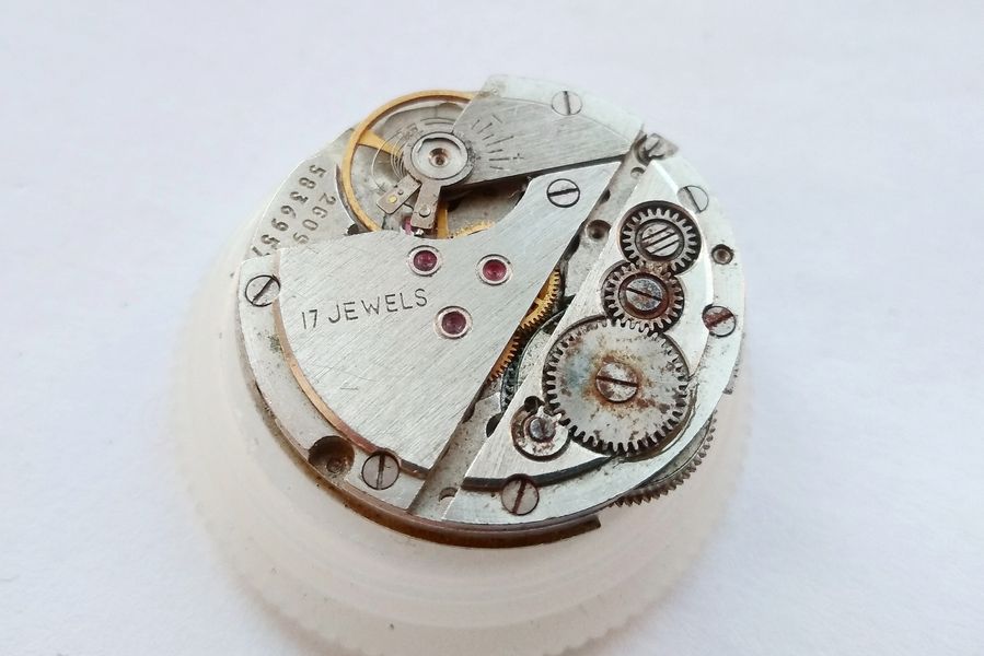 Poljot 2609 movement seen from the train side with three winding wheels grouped on the barrel bridge