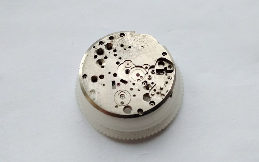 The cleaned dial side of the plate showing some residual corrosion
