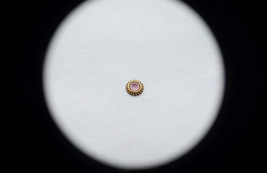The intermediate wheel removed showing a large jewel set into its body and a bevelled rim