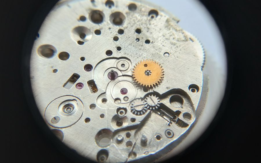 The dial side mid-assembly, pausing before the minute wheel is fitted