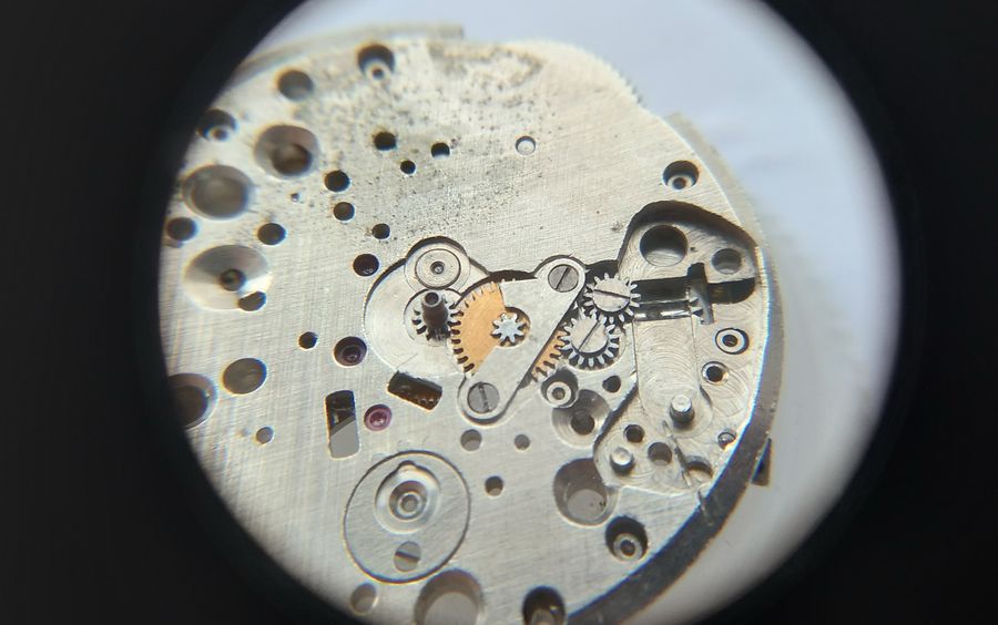 Installing the minute-wheel bridge over the jewelled minute wheel