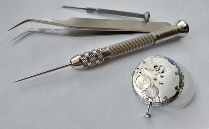 Professional watchmaking tools arranged for service