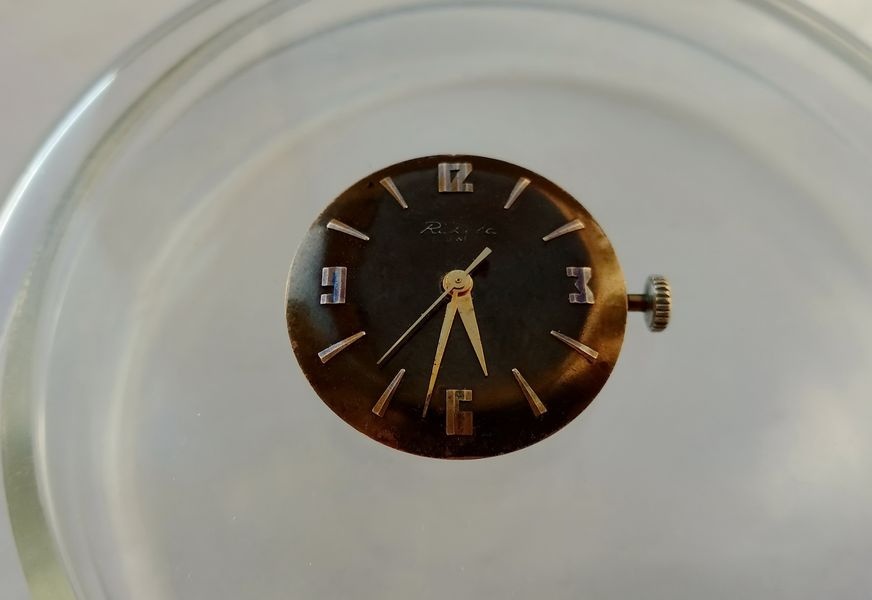 Raketa 2609B movement fitted with temporary test hands to verify timekeeping under mechanical load before case installation
