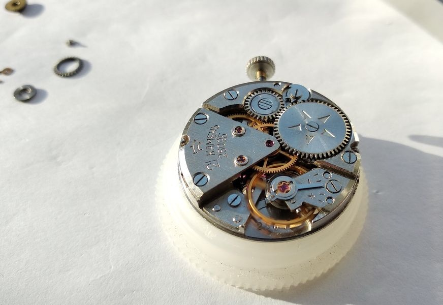 Raketa 2609B movement running after complete reassembly, balance oscillating freely with visible amplitude