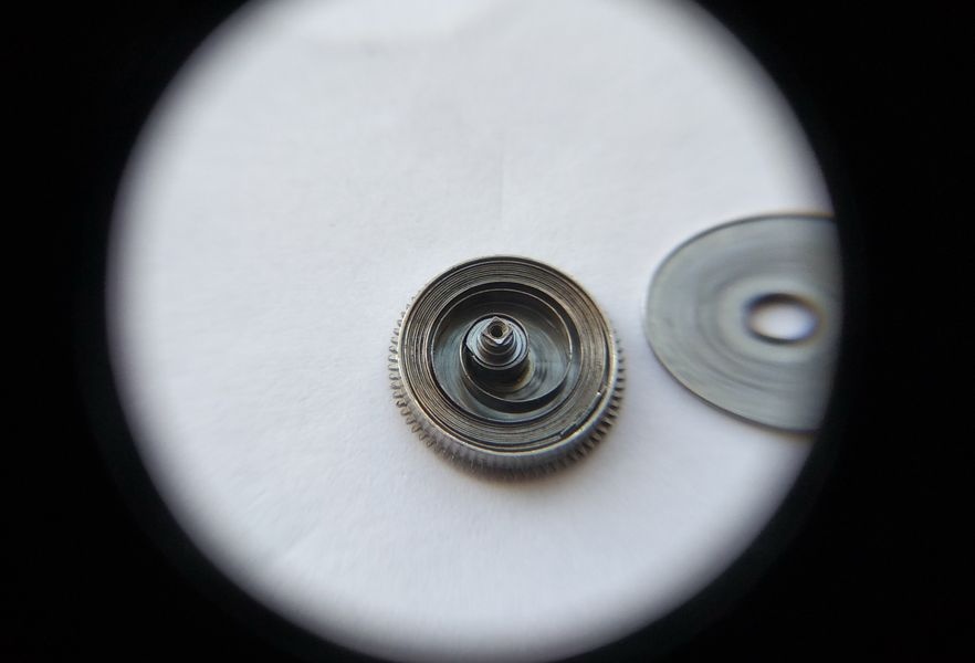 Setting lever spring of the Raketa 2609B removed and shown in isolation — a simple straight leaf spring
