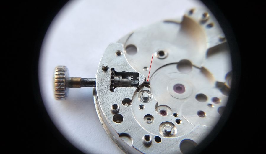Crown stem tail of the Raketa 2609B being lubricated at the cylindrical bearing surface that runs against the main plate and keyless works components