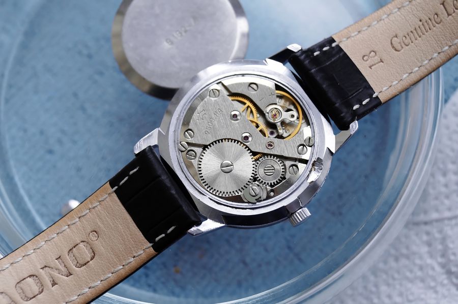 Open caseback view of the clean, serviced 2609.NA movement before closing