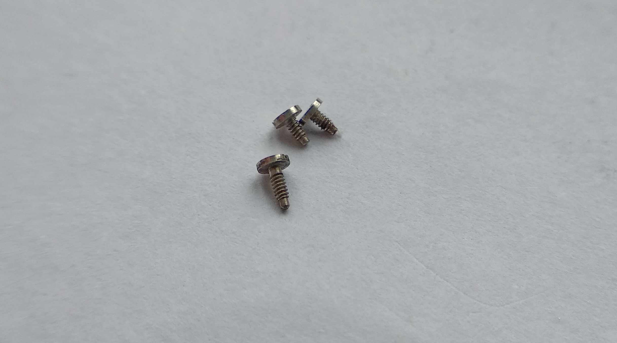 The three barrel-bridge screws compared: two short and one long