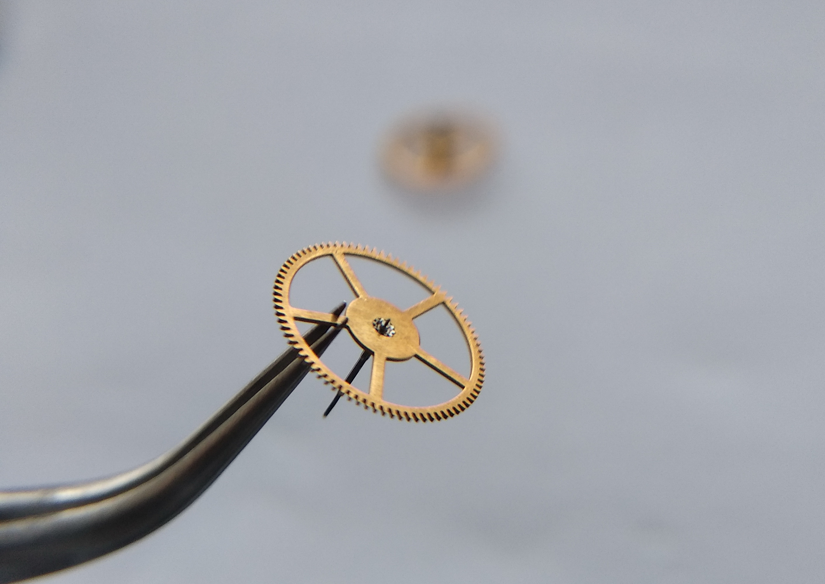 Seconds wheel viewed from a different angle showing its pinion and pivot