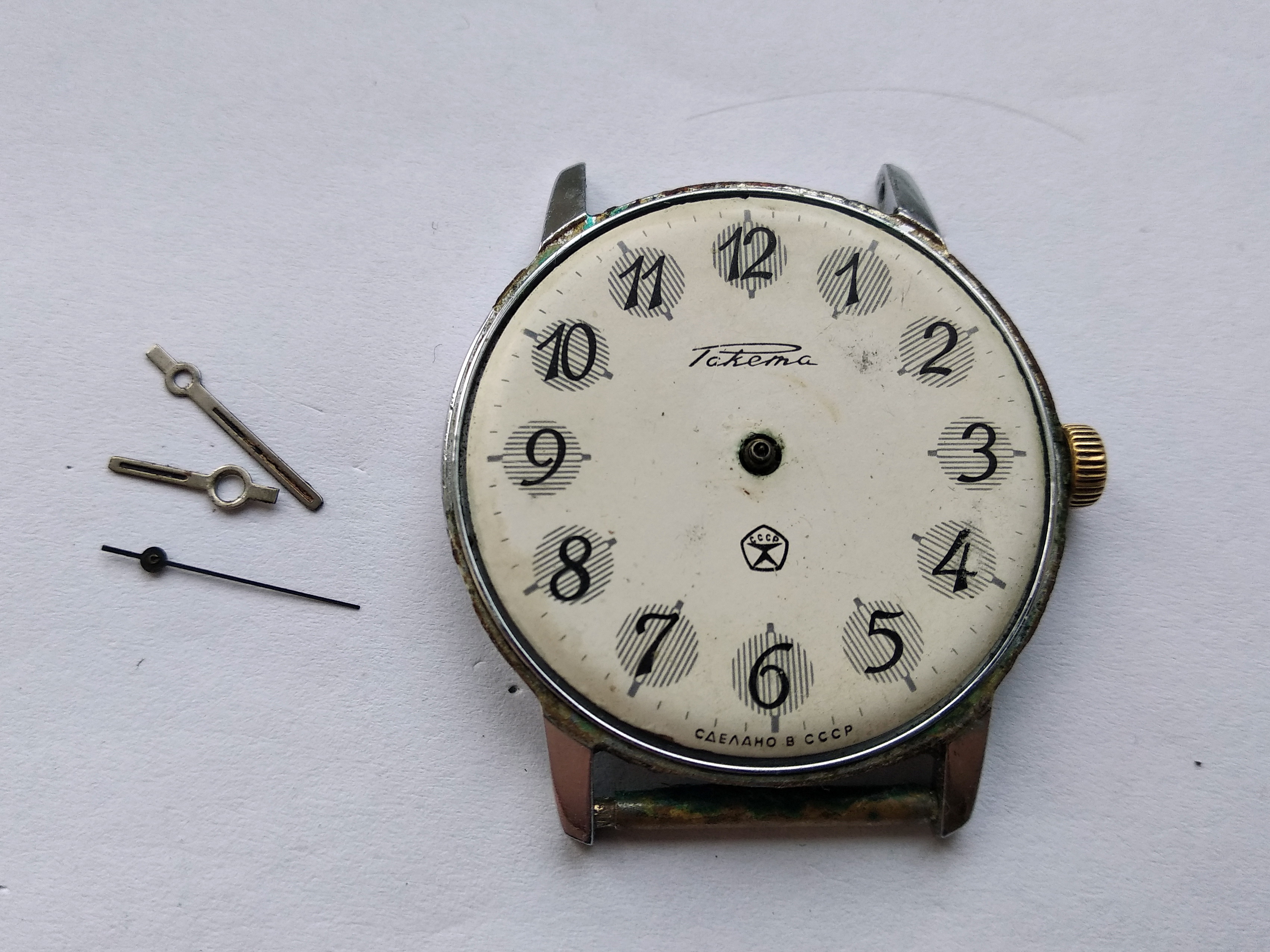 Hands being levered off through a protective film laid over the dial to prevent scratches