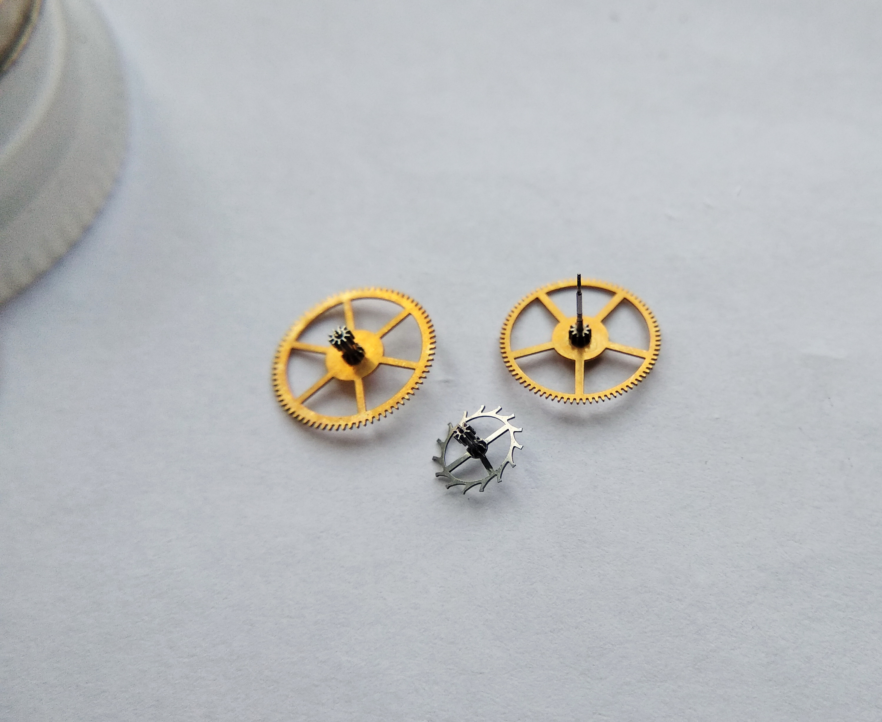 Intermediate, seconds, and escape wheels removed from the plate