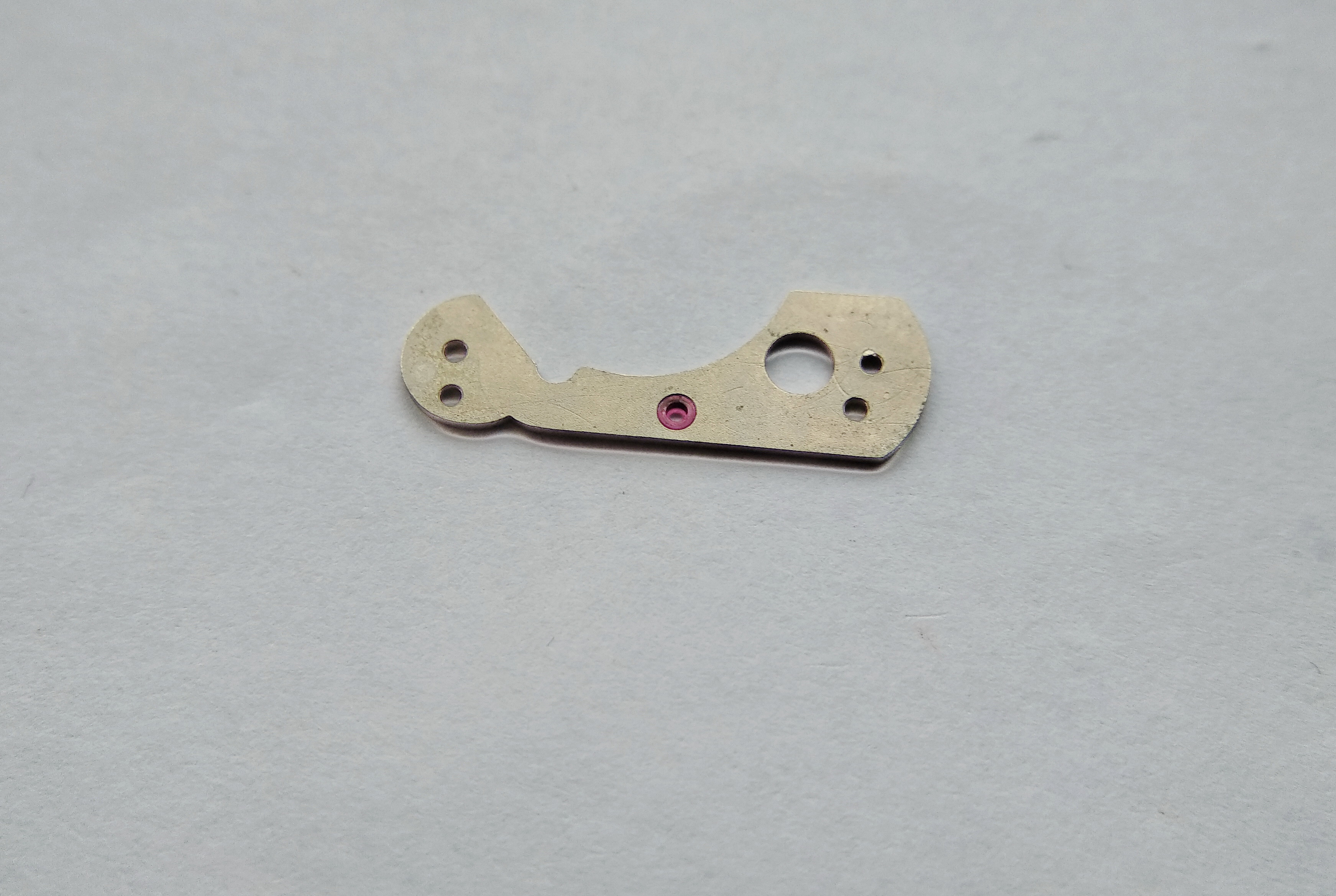 Center wheel jewel that receives the wheel boss, to be oiled from the reverse side