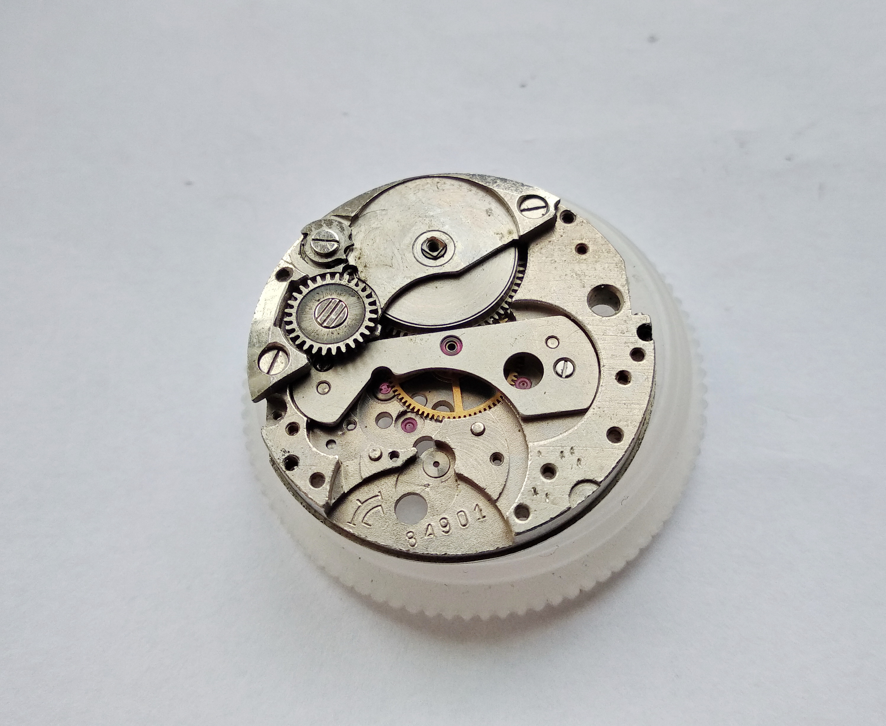 Beginning disassembly of the mainspring barrel assembly and its bridge