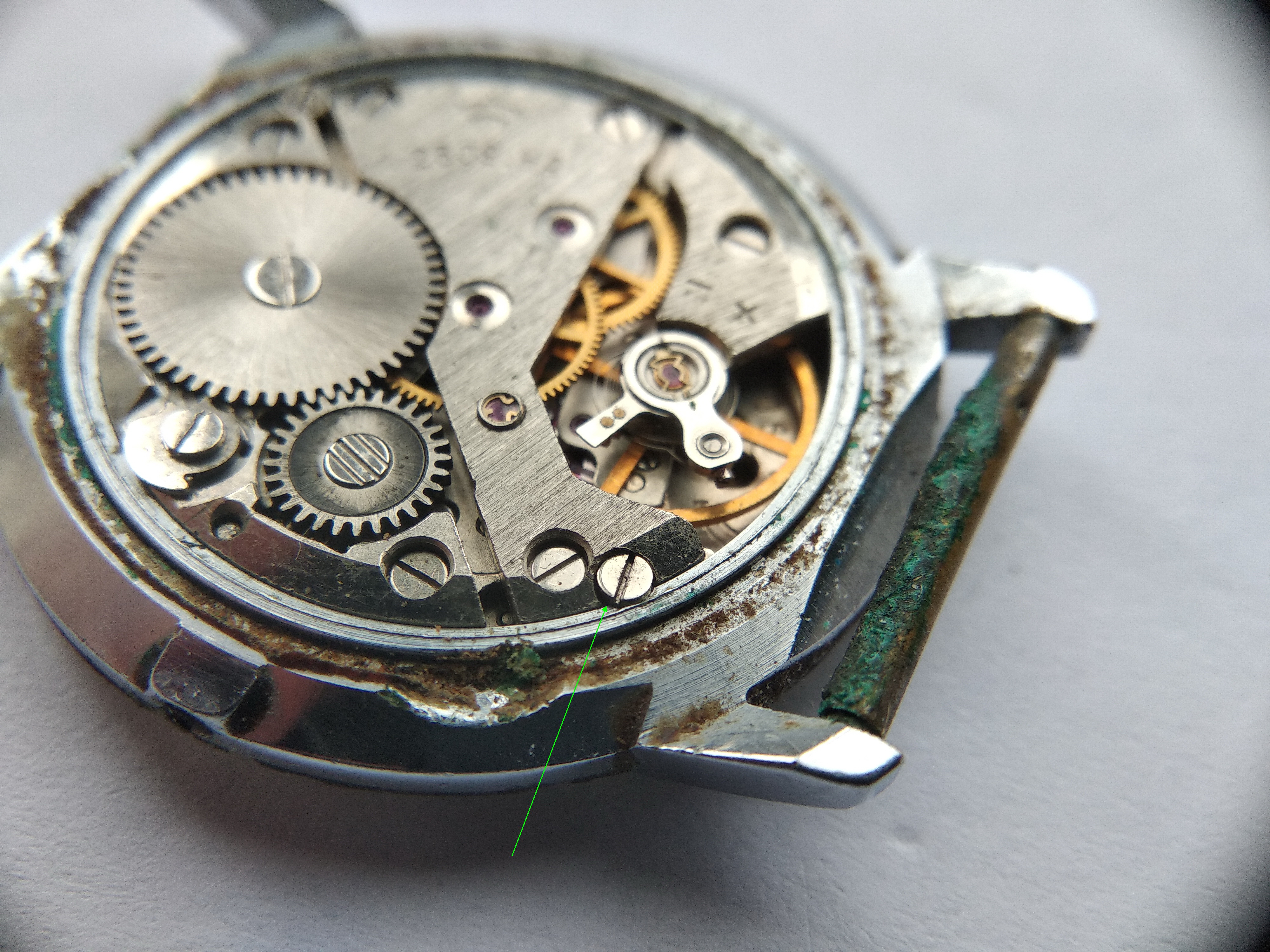 Case clamp screws that hold the movement inside the three-part case