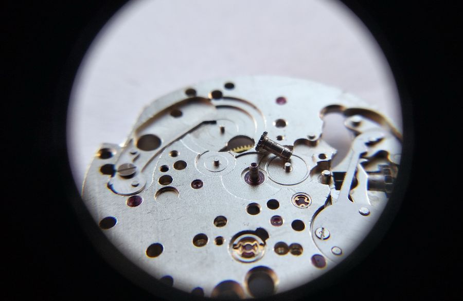 The cannon pinion being pressed onto the center-wheel arbor
