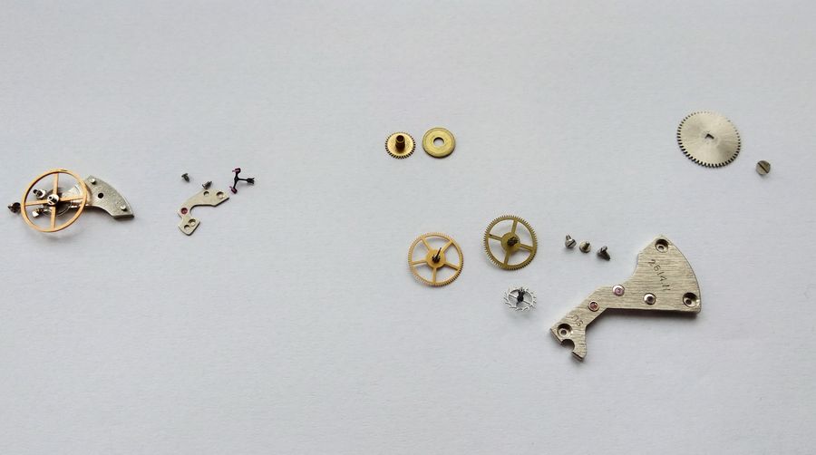 The going-train wheels removed from the plate and laid out together