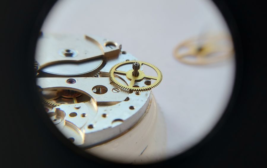 The intermediate (third) wheel being set into its jewel on the plate